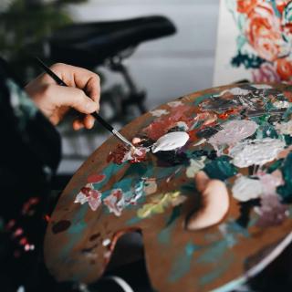 hand holding a paint palette