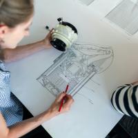 two engineers discussing a diagram