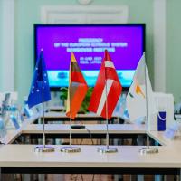 Flags together on a table in a meeting room